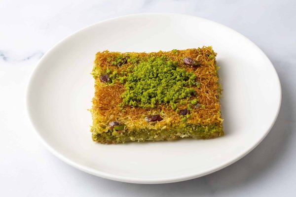 Wie kreiert man eine indische Butter Chicken mit einem samtigen Tomatensauce?